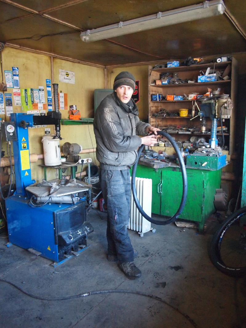 worker fixing my bike. we&rsquo;re inside his shop, but better stay fully
dressed